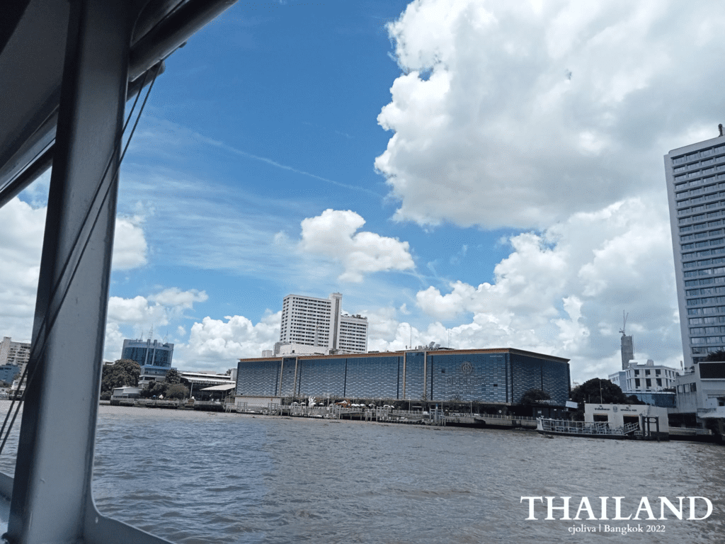 Scenic view of Bangkok’s Chao Phraya River with ICONSIAM and modern buildings under a bright sky