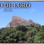 A view of the rocky summit of Mt. Pico de Loro against a clear blue sky, showing the unique parrot-beak-shaped peak in Cavite.