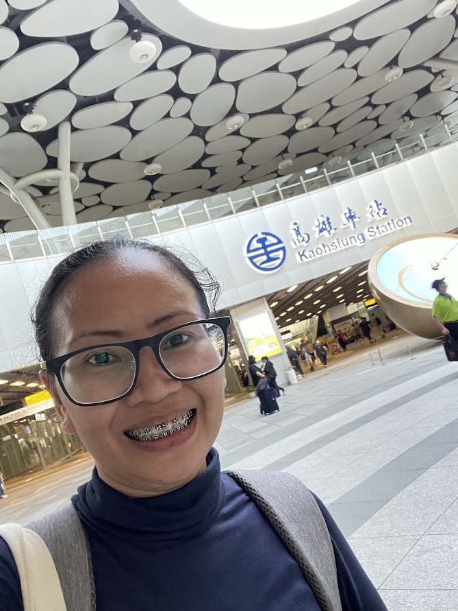 Solo traveler at Kaohsiung Main Station in Taiwan's railway hub