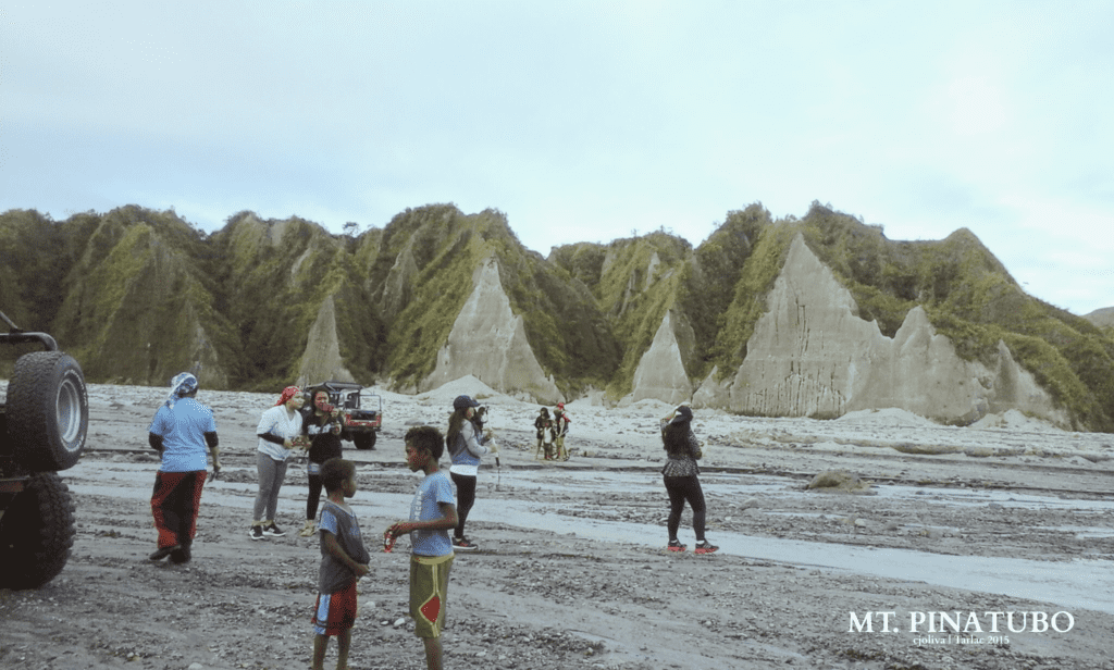 A group of people taking a 4x4 tour of Mount Pinatubo in the Philippines.