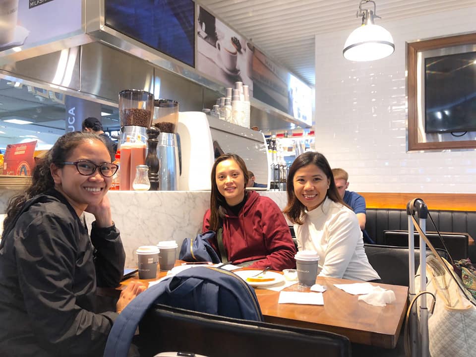 Three female travelers having coffee at Dean & Deluca in Suvarnabhumi Airport, Bangkok.