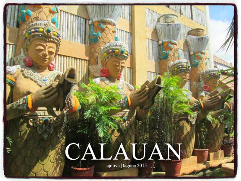 Row of ornate statues holding fish fountains at Calauan cultural site in Laguna, Philippines