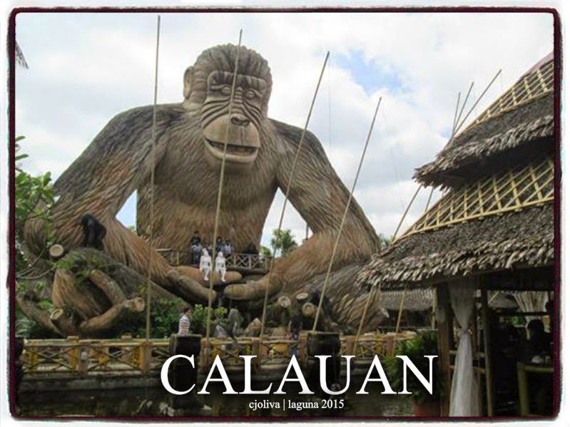 Massive gorilla sculpture made of bamboo and wood with visitors standing on a viewing platform in Calauan, Laguna, Philippines