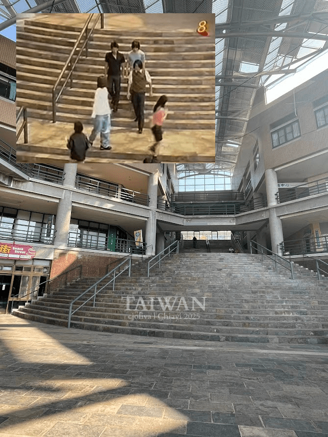 Large staircase in modern Chiayi building with glass ceilings and inset Meteor Garden scene filmed on location