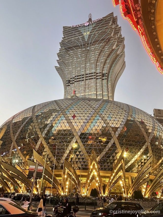 Grand Lisboa Hotel and Casino in Macau with lotus-shaped tower illuminated at night