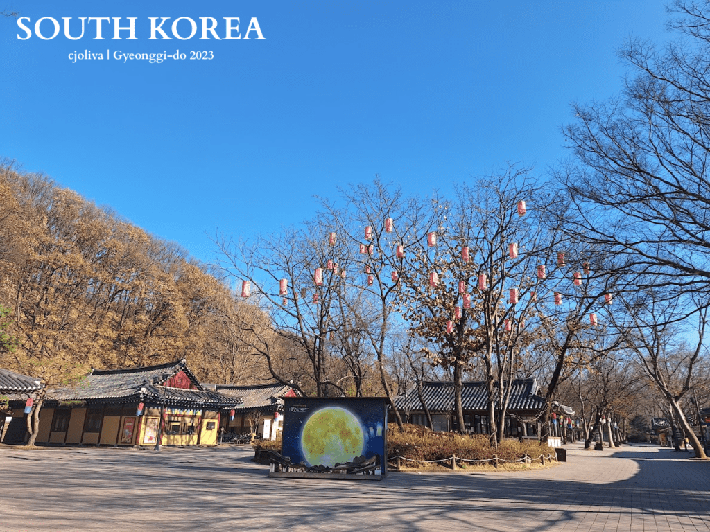 Traditional Korean architecture with red lanterns and moon display at Korean Folk Village in Gyeonggi-do, South Korea, 2023