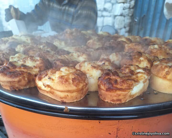 Close-up of steaming gyeran-ppang, Korean egg bread pastries, freshly baked and served hot by a street vendor in Seoul.