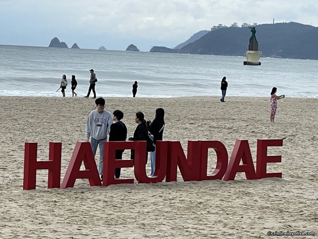 Haeundae Beach in Busan with red Haeundae letters and seaside view