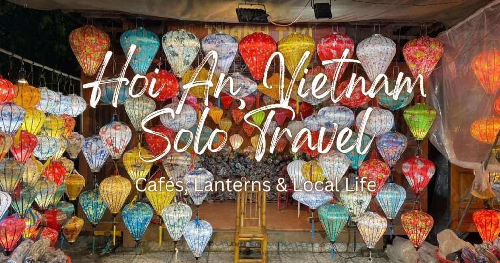 Glowing silk lanterns around a wooden chair at a night market stall, a highlight of my Hoi An solo travel
