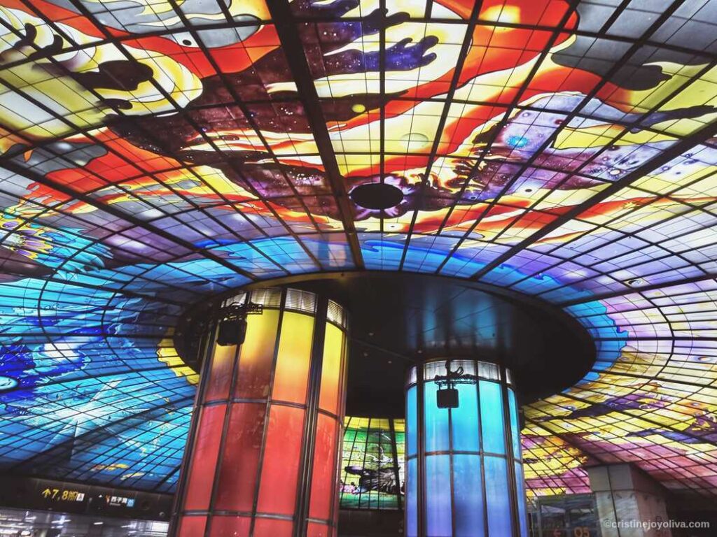 Dome of Light at Formosa Boulevard Station in Kaohsiung, Taiwan with vibrant stained glass ceiling