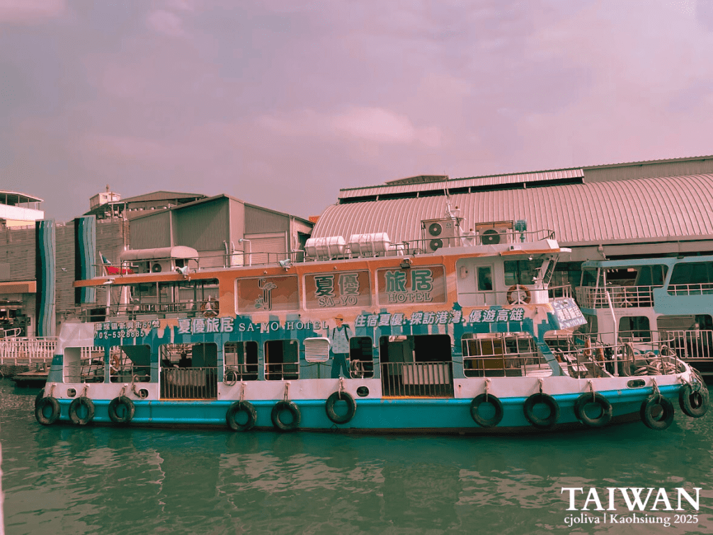 Colorful SA‑YO Hotel boat docked at Kaohsiung harbor with multiple windows, life rings, and air conditioning units