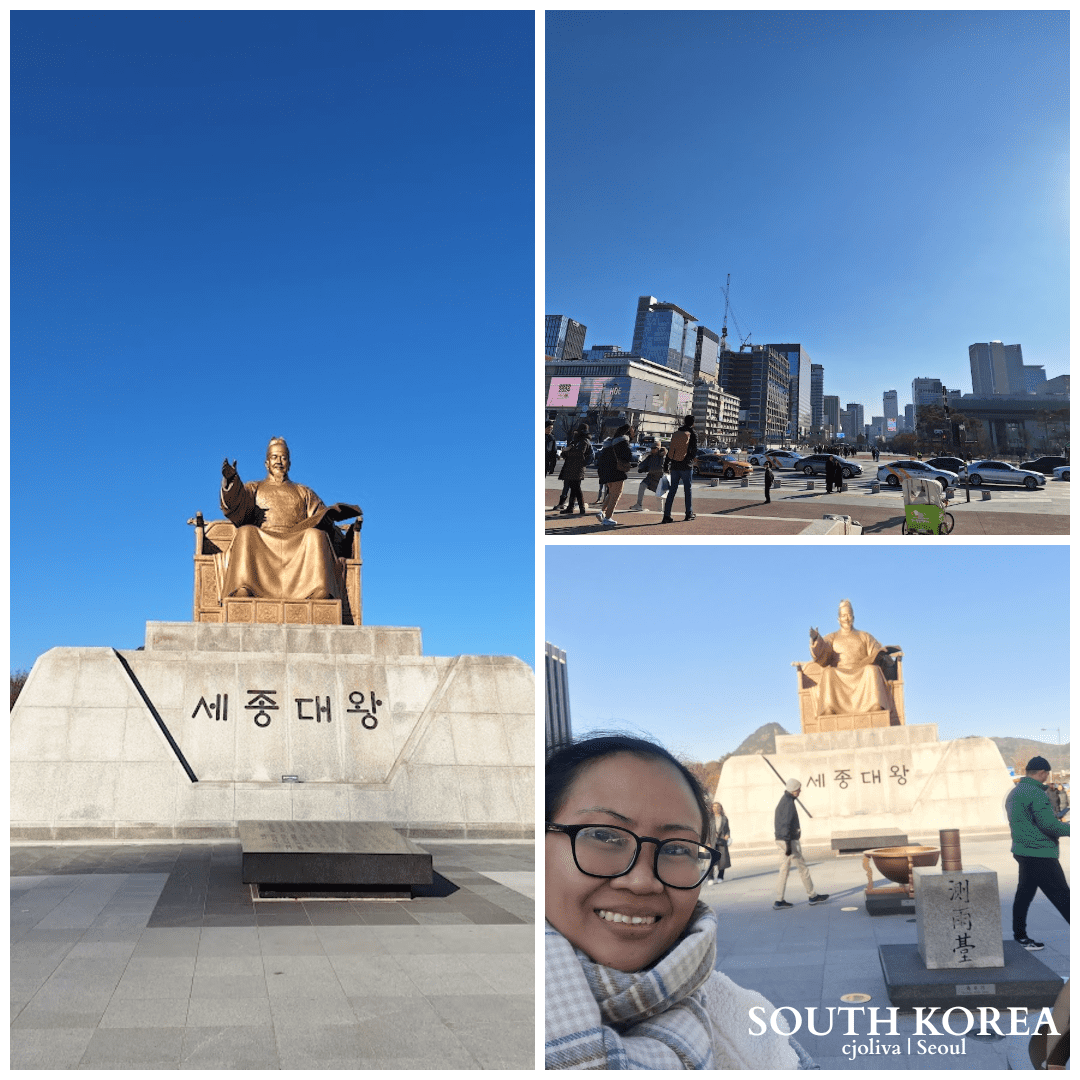 Golden bronze statue of King Sejong the Great seated on a throne in Gwanghwamun Square, Seoul, under a clear blue sky.