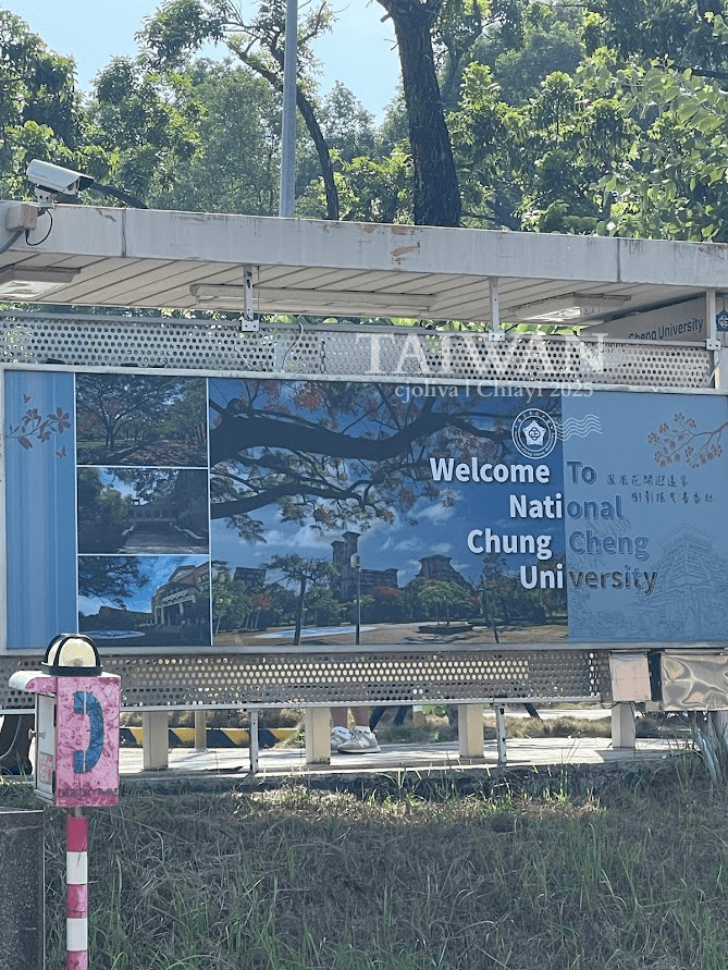 Welcome sign at National Chung Cheng University in Chiayi, Taiwan, surrounded by lush greenery, marking the entrance to the campus and its role as a Meteor Garden filming location.