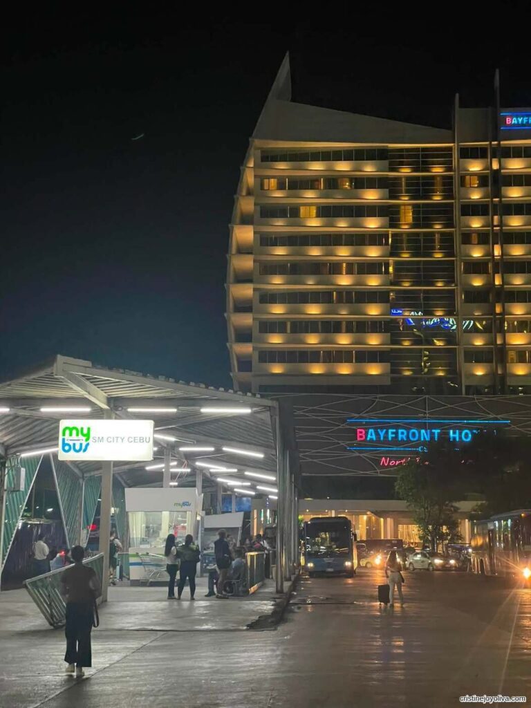Bayfront Hotel and MyBus terminal at night in Cebu