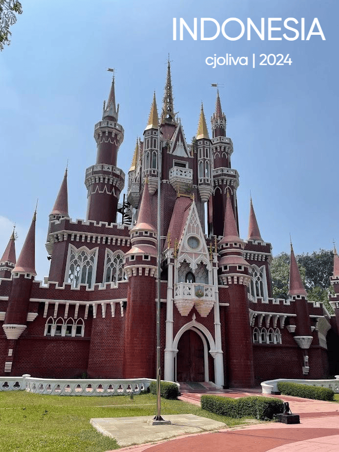 Red fairy-tale-style castle structure of Children's Palace (Istana Anak-Anak Indonesia) at Taman Mini Indonesia Indah in Jakarta.