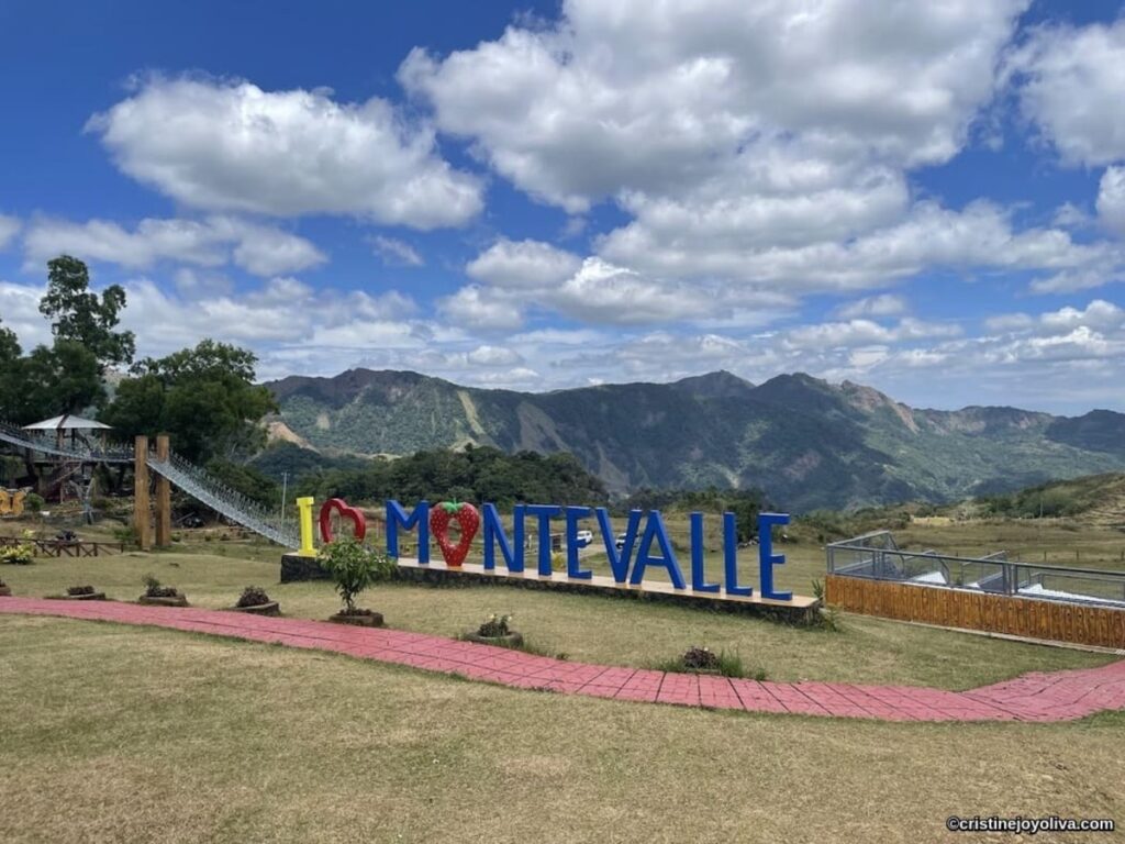 I Love Monte Valle landmark sign with the suspension bridge and scenic mountain view in Aningalan, San Remigio, Antique.