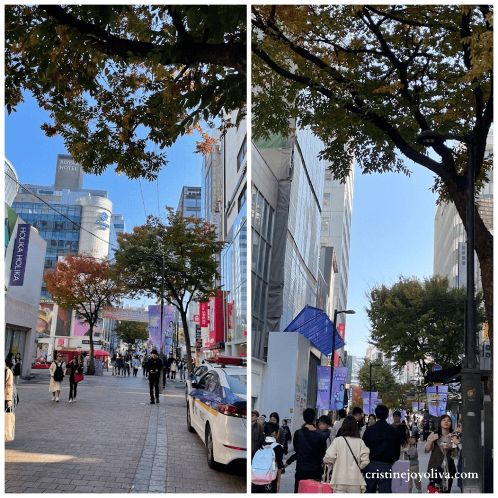 A collage of two photos showing the busy pedestrian streets of Myeongdong, Seoul, with autumn trees, city shoppers, and storefronts under a clear blue sky.