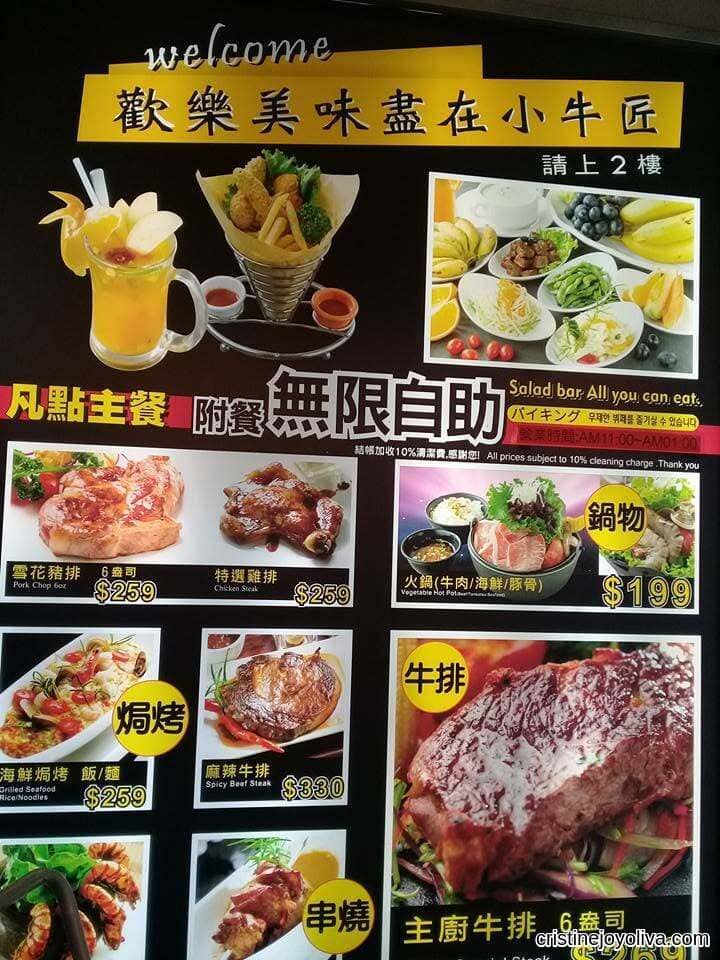 Black menu board showing various steak, hotpot, and baked rice dishes with prices in Traditional Chinese and English.