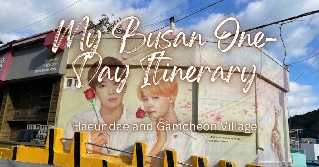 A colorful outdoor wall mural of BTS members Jimin and Jungkook holding red roses on a sloped street in Gamcheon Culture Village during a Busan one-day itinerary.