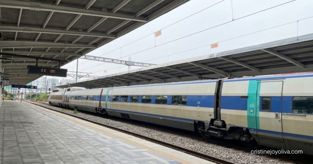 Cream and blue high-speed train on the next track while I waited at a covered platform for the ITX-Maum from Seoul to Busan