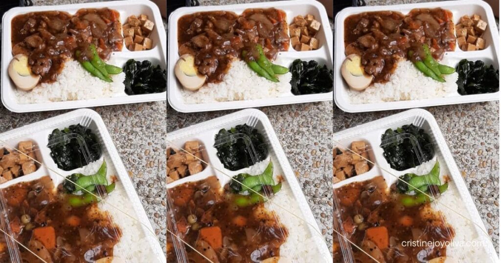 Packed bento boxes filled with white rice, braised meat, tea egg, edamame, and seasoned tofu.