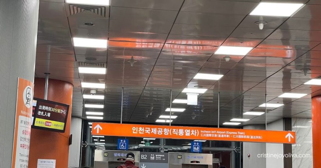 AREX Express Train gates at Seoul Station with a sign pointing to Incheon International Airport