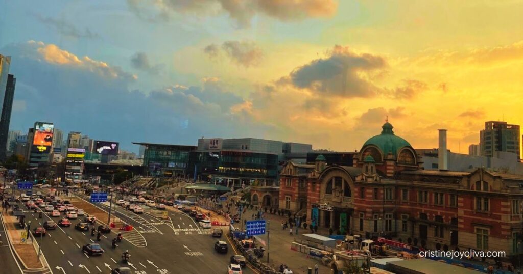 Old Seoul Station building, now Culture Station Seoul 284, beside a busy boulevard and the modern station at sunset